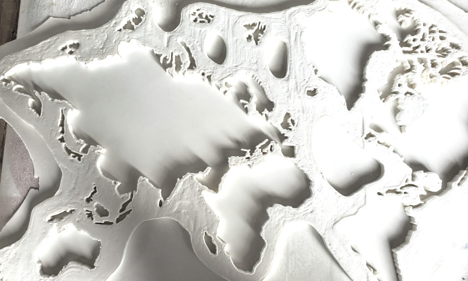 Mould PreparationA detailed mould captures the contours of the continents, including their smallest edges and islands.